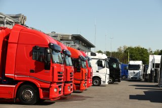 TRUCKS IN PADDOCK