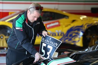 MECHANIC STICKING A BLANCPAIN GT SERIES STICKER