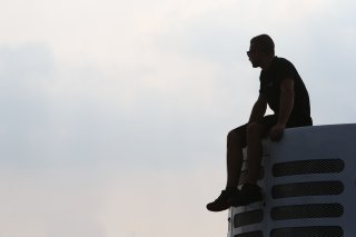 MECHANIC ON ROOF OF A TRUCK