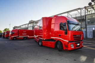 TRUCKS IN PADDOCK