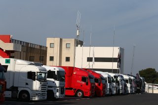 TRUCKS IN PADDOCK