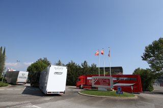TRUCKS ENTER THE PADDOCK