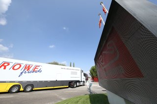 TRUCKS ENTER THE PADDOCK