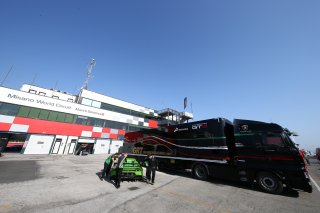 TRUCKS IN PADDOCK
