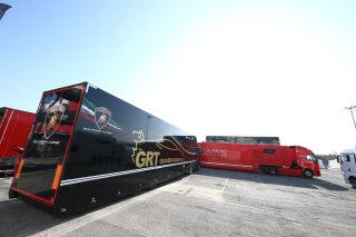 TRUCKS IN PADDOCK