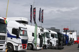 TRUCKS IN PADDOCK