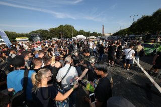 FANS AND DRIVERS SIGNING AUTOGRAPHS
