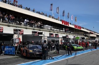 Cars in the pit lane at the start of pre qualifying
