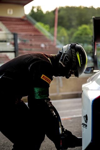 A mechanic in the pit lane
