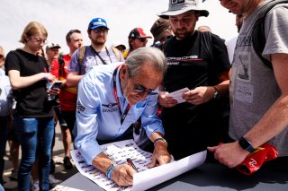 Jacky Ickx signs autographs for fans