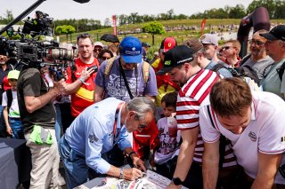 Jacky Ickx signs autographs for fans