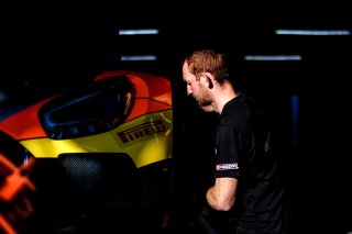 Mechanics at work in the pit lane