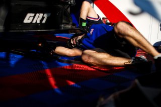 Mechanics at work in the pit lane