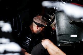 Mechanics in the pit lane