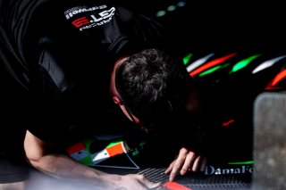 Mechanics in the pit lane