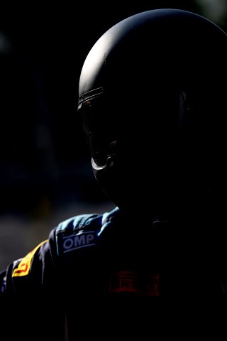 A mechanic in the pit lane