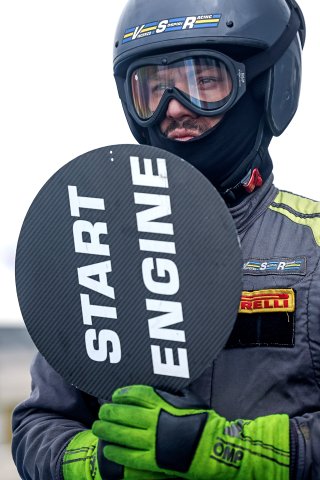 A mechanic in the pit lane