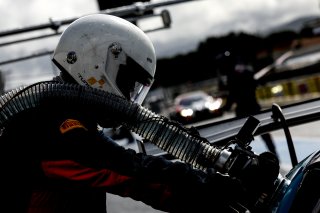 Mechanics in the pit lane