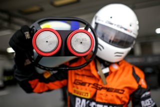A mechanic in the pit lane