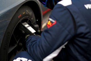Mechanics in the pit lane
