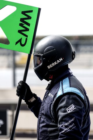 Mechanics in the pit lane