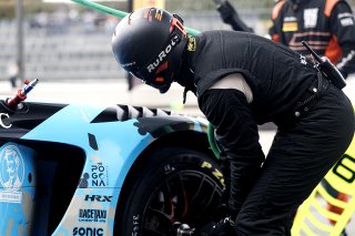 Mechanics in the pit lane