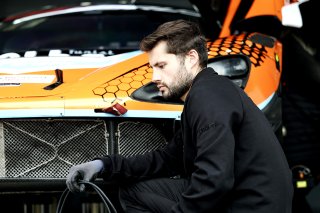 Mechanics in the pit lane