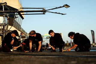 Mechanics in the pit lane