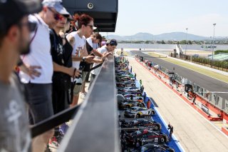 The cars line up in the pit lane for Qualifying 1
