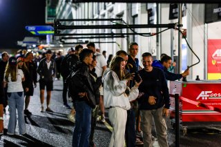 Fans pit walk by night