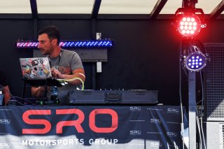 A DJ in the paddock