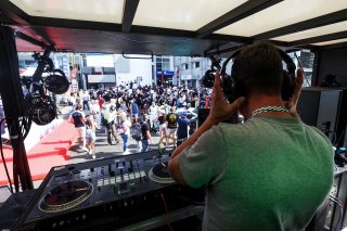A DJ in the paddock