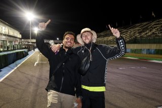 Fans walk the track