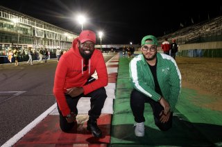 Fans walk the track