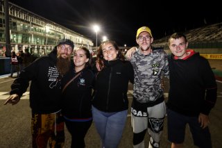 Fans walk the track