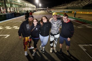 Fans walk the track