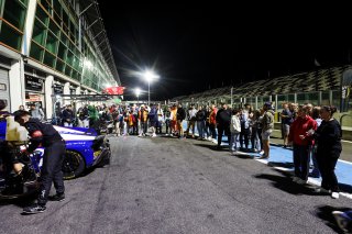 Fans walk the track