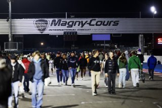 Fans walk the track