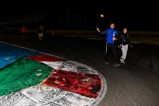 Fans walk the track
