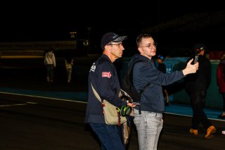 Fans walk the track
