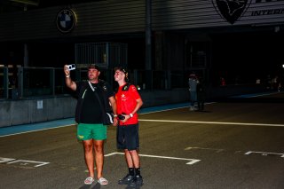 Fans walk the track