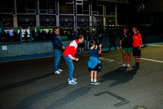 Fans walk the track