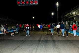Fans walk the track