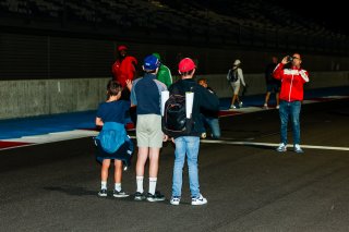 Fans walk the track