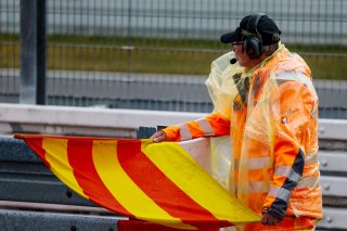 A marshal warns of wet conditions in the Bronze Test