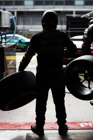 A mechanic in the pit lane