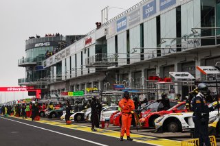 The cars line up in the pit lane for Qualifying