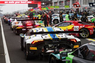 The cars line up in the pit lane for Qualifying