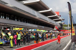 Cars in the pit lane for testing