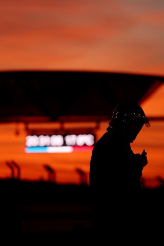 A marshal in the pitlane